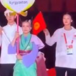 КУУнун студенти Бейшенова Айжанат XX Азия оюндарынын ачылыш аземинде Кыргызстандын желегин көтөрүп чыкты